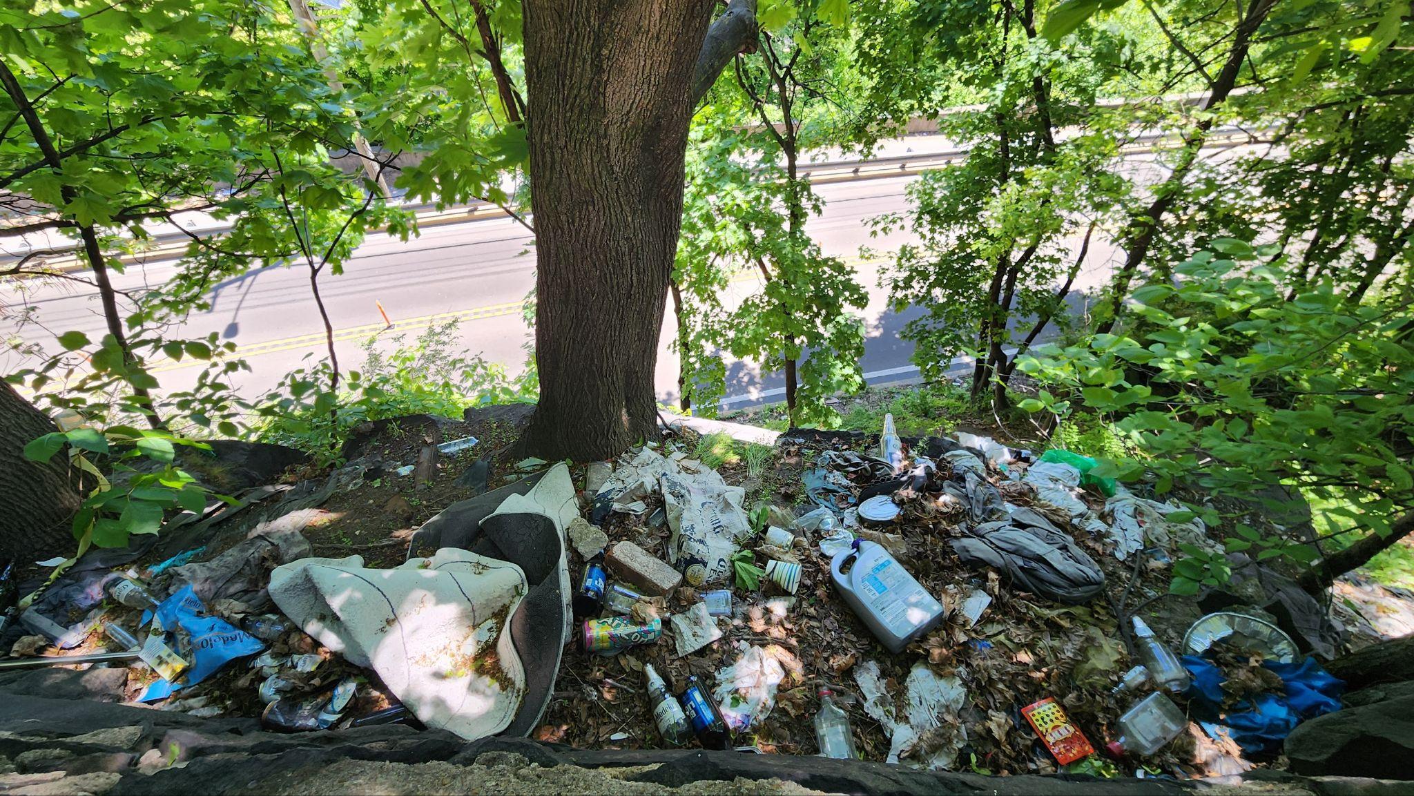 Trash below Riverview Park